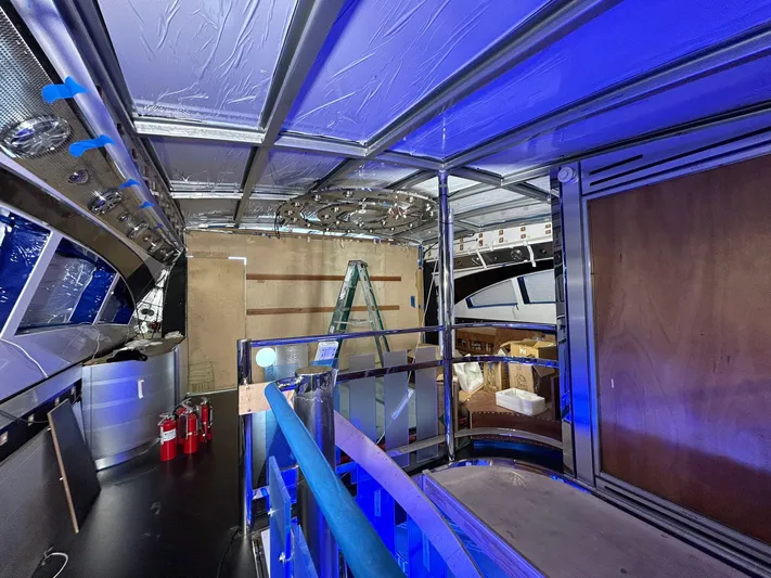 1992/2016 Heesen Motor Yacht Yacht Photos Pics Interior view of 1992 Heesen 141 Motor Yacht under renovation with blue lighting.