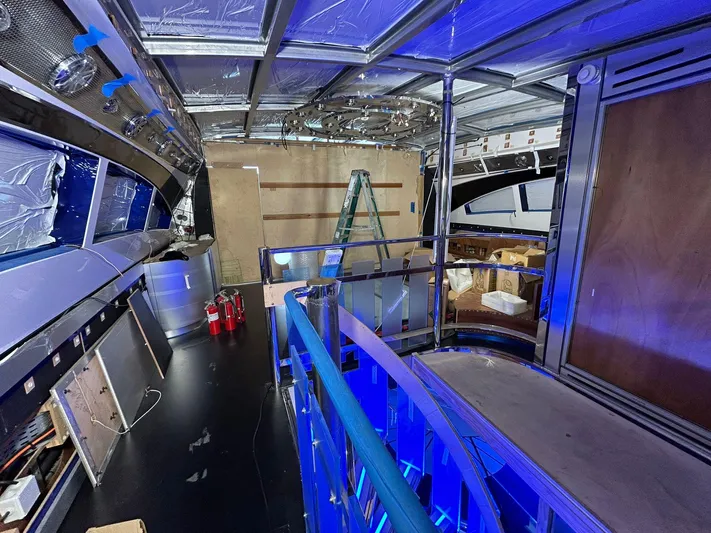 1992/2016 Heesen Motor Yacht Yacht Photos Pics Interior renovation of a 1992 Heesen 141 Motor Yacht with blue lighting and construction materials.