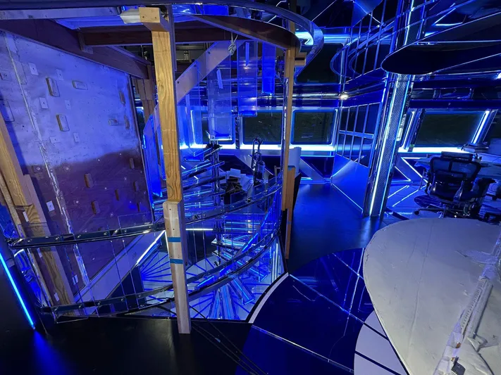 1992/2016 Heesen Motor Yacht Yacht Photos Pics Interior of 1992 Heesen 141 Motor Yacht with modern blue lighting and spiral staircase.