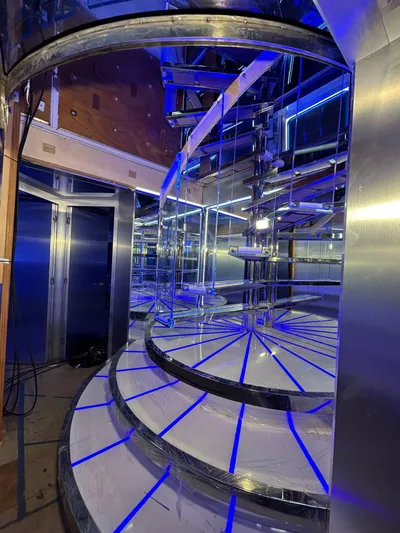 1992/2016 Heesen Motor Yacht Yacht Photos Pics Luxurious spiral staircase with blue LED lighting on a 1992 Heesen 141 Motor Yacht.