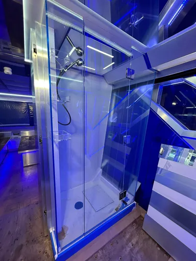 1992/2016 Heesen Motor Yacht Yacht Photos Pics Luxurious shower cabin on 1992 Heesen 141 Motor Yacht, featuring modern blue LED lighting.