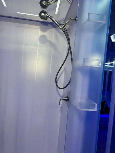 1992/2016 Heesen Motor Yacht Yacht Photos Pics Shower area inside 1992 Heesen 141 Motor Yacht with modern fixtures and blue lighting.