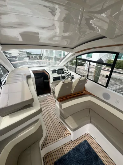 Saviour Yacht Photos Pics Luxurious interior of 2022 Evolve 400HT yacht with plush seating and modern dashboard.