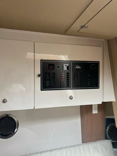 Saviour Yacht Photos Pics Control panel of 2022 Evolve 400HT boat, featuring AC and DC switches.