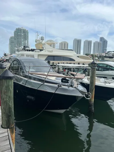 Saviour Yacht Photos Pics Luxury yacht Evolve 400HT 2022 docked at marina with city skyline.