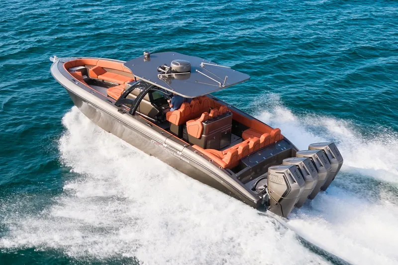  Yacht Photos Pics High-speed Midnight Express 37' Open boat cruising on ocean waters.
