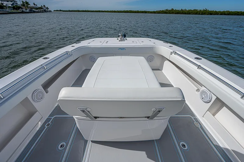  Yacht Photos Pics Invincible 37 Catamaran 2020, spacious deck with seating, on calm waters.