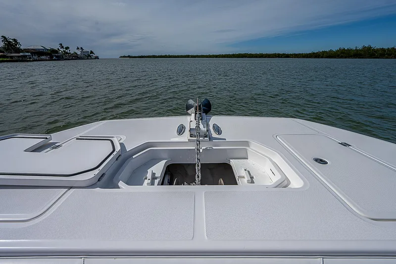  Yacht Photos Pics Bow view of 2020 Invincible 37 Catamaran on calm waters.