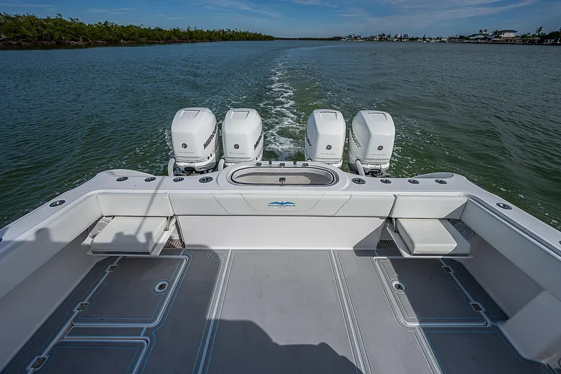  Yacht Photos Pics 2020 Invincible 37 Catamaran with four outboard engines cruising on open water.