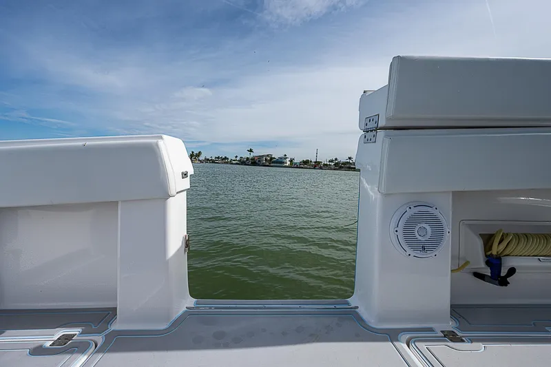  Yacht Photos Pics Invincible 37 Catamaran 2020, rear view, overlooking calm waters and distant shoreline.