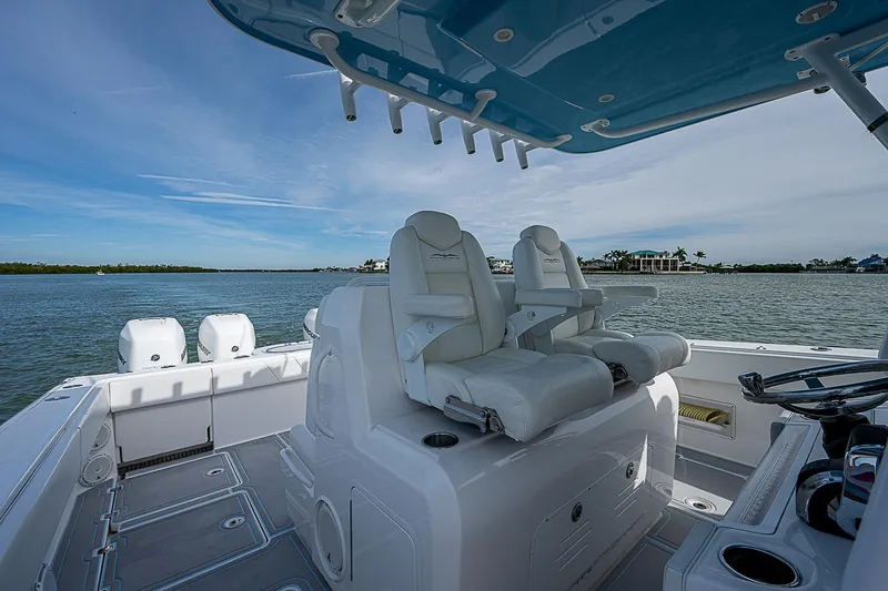  Yacht Photos Pics 2020 Invincible 37 Catamaran interior with white seating and ocean view.