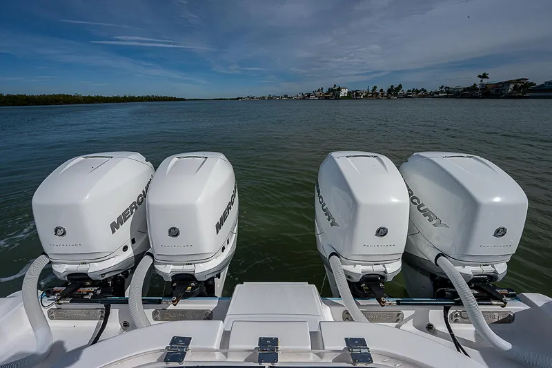  Yacht Photos Pics Four Mercury outboard engines on a 2020 Invincible 37 Catamaran, cruising on calm waters.