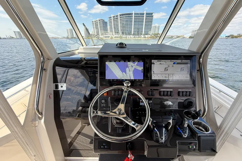 Alroma Yacht Photos Pics 2022 Pursuit S 358 Sport boat helm with advanced navigation displays and controls.