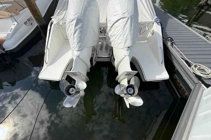 Alroma Yacht Photos Pics 2022 Pursuit S 358 Sport boat with covered engines at dock.