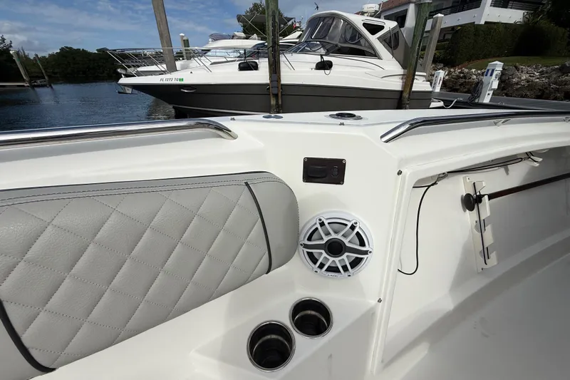 Alroma Yacht Photos Pics 2022 Pursuit S 358 Sport boat interior with speaker and cup holders.