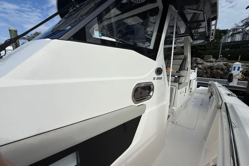 Alroma Yacht Photos Pics 2022 Pursuit S 358 Sport boat, sleek white exterior, docked with modern design features.