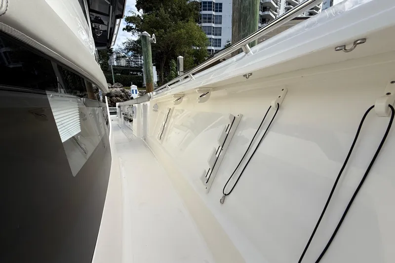 Alroma Yacht Photos Pics 2022 Pursuit S 358 Sport boat docked, showcasing sleek side view and modern design.