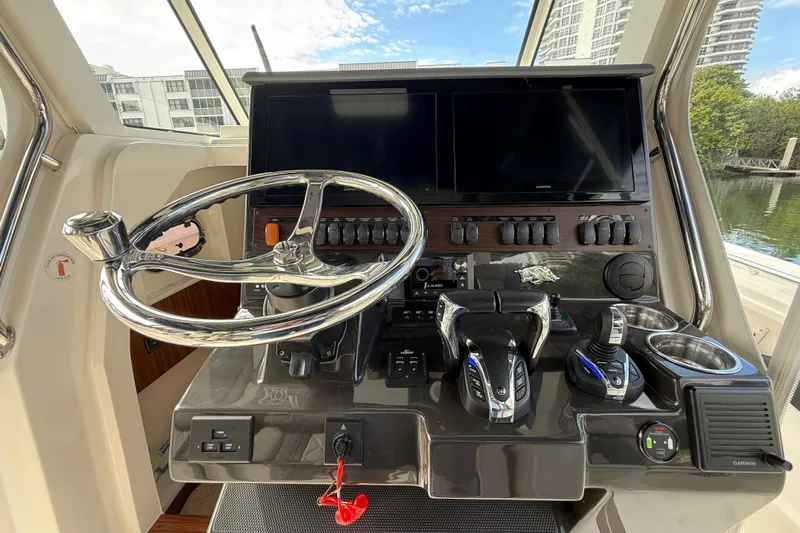 Alroma Yacht Photos Pics 2022 Pursuit S 358 Sport boat helm with dual screens and modern controls.