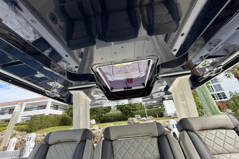 Alroma Yacht Photos Pics Interior view of 2022 Pursuit S 358 Sport boat with luxurious seating and sleek design.