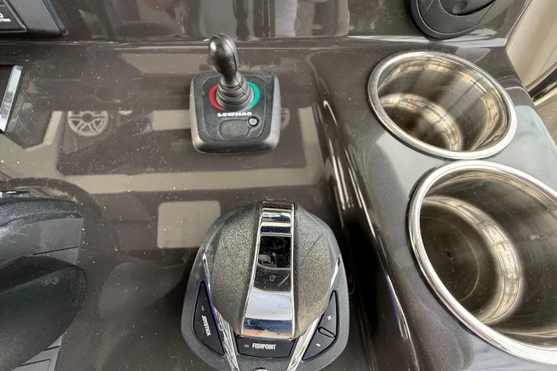 Alroma Yacht Photos Pics Control panel of 2022 Pursuit S 358 Sport boat with joystick and cup holders.