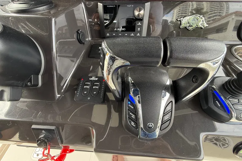 Alroma Yacht Photos Pics Control panel of 2022 Pursuit S 358 Sport boat with throttle and navigation controls.