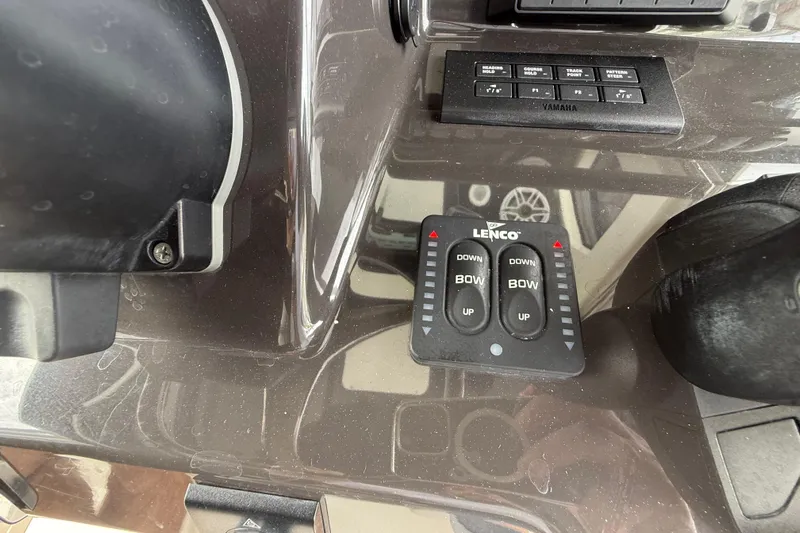 Alroma Yacht Photos Pics Control panel of 2022 Pursuit S 358 Sport boat with Lenco trim tab switches.