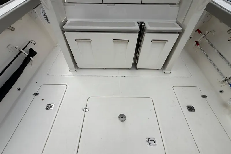 Alroma Yacht Photos Pics 2022 Pursuit S 358 Sport boat deck with storage compartments and clean white finish.