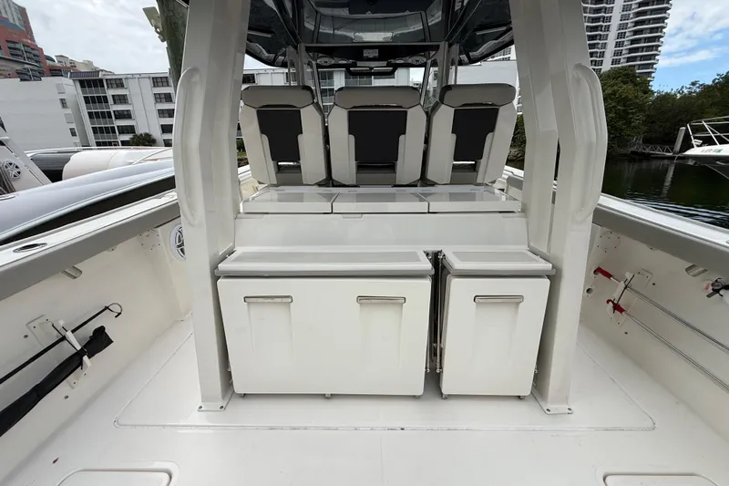 Alroma Yacht Photos Pics 2022 Pursuit S 358 Sport boat interior with seating and storage compartments.
