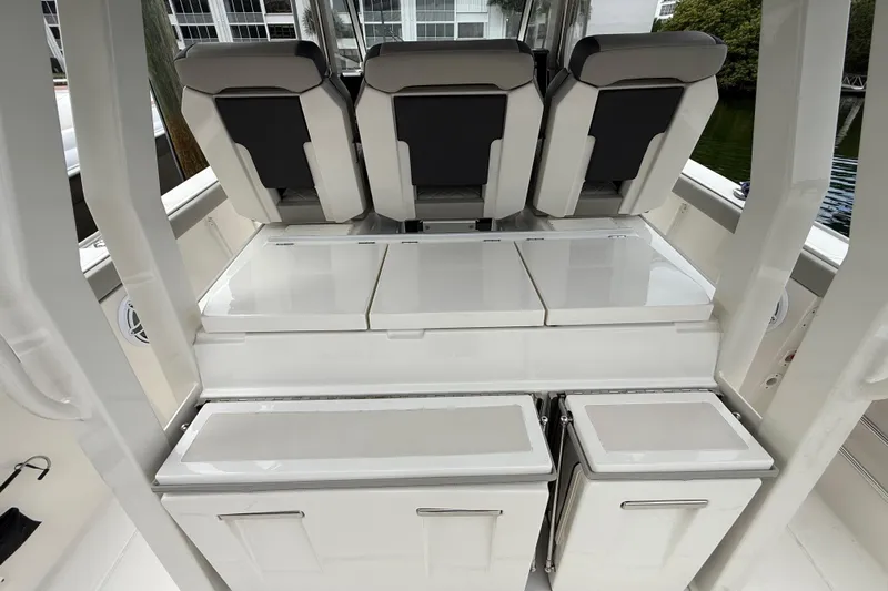 Alroma Yacht Photos Pics 2022 Pursuit S 358 Sport boat interior with sleek seating and storage compartments.