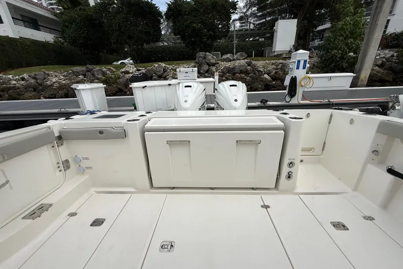 Alroma Yacht Photos Pics 2022 Pursuit S 358 Sport boat interior with storage compartments and seating.