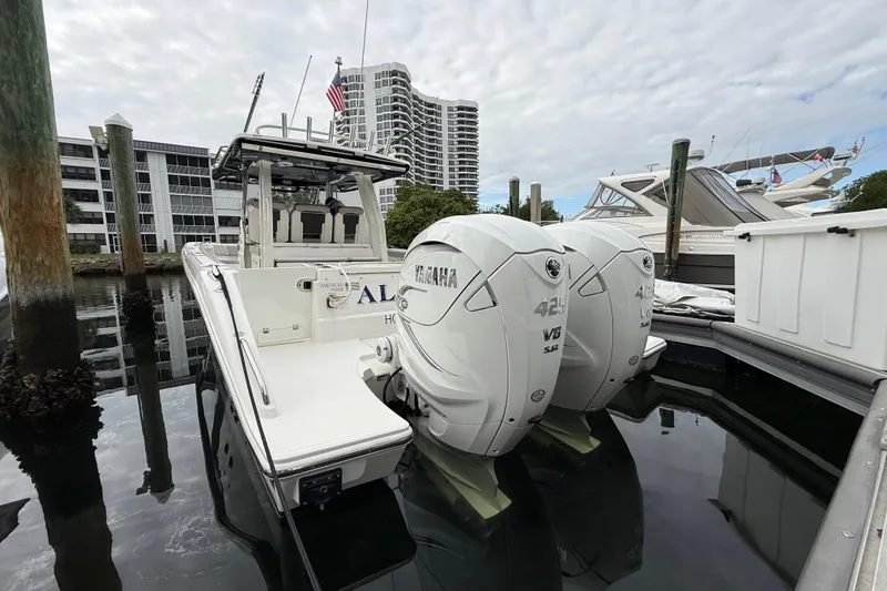 Alroma Yacht Photos Pics 2022 Pursuit S 358 Sport boat with twin Yamaha 425 V8 engines docked in marina.