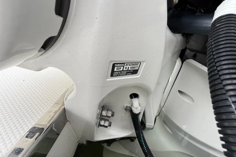 Alroma Yacht Photos Pics Close-up of 2022 Pursuit S 358 Sport boat engine details and label.