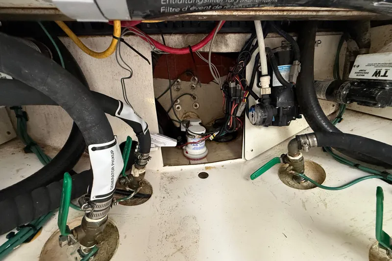 Alroma Yacht Photos Pics Engine compartment of 2022 Pursuit S 358 Sport boat, showing hoses and wiring.