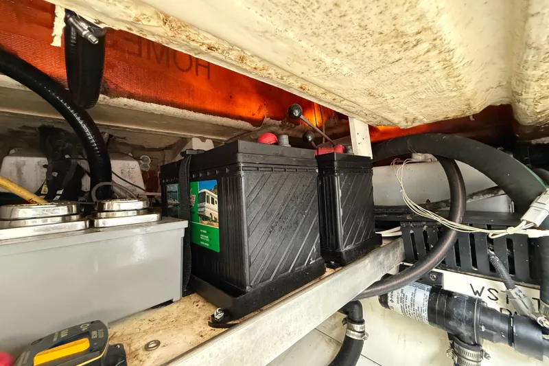 Alroma Yacht Photos Pics Battery compartment of 2022 Pursuit S 358 Sport boat, showing wiring and components.