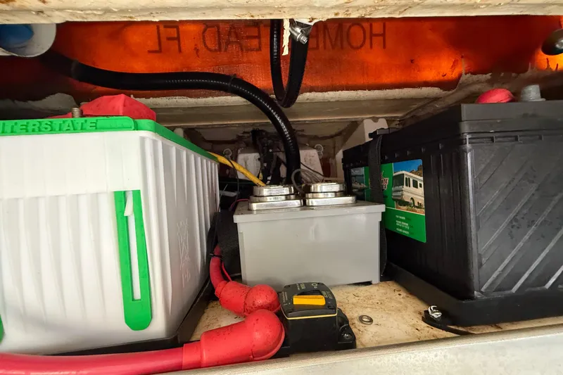 Alroma Yacht Photos Pics Battery compartment of 2022 Pursuit S 358 Sport with wiring and components.