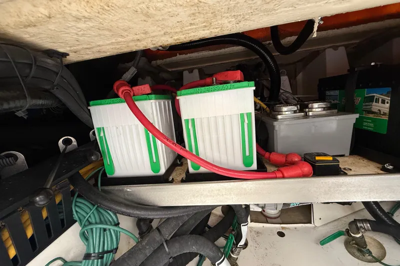 Alroma Yacht Photos Pics Battery compartment of a 2022 Pursuit S 358 Sport boat, featuring Interstate batteries.