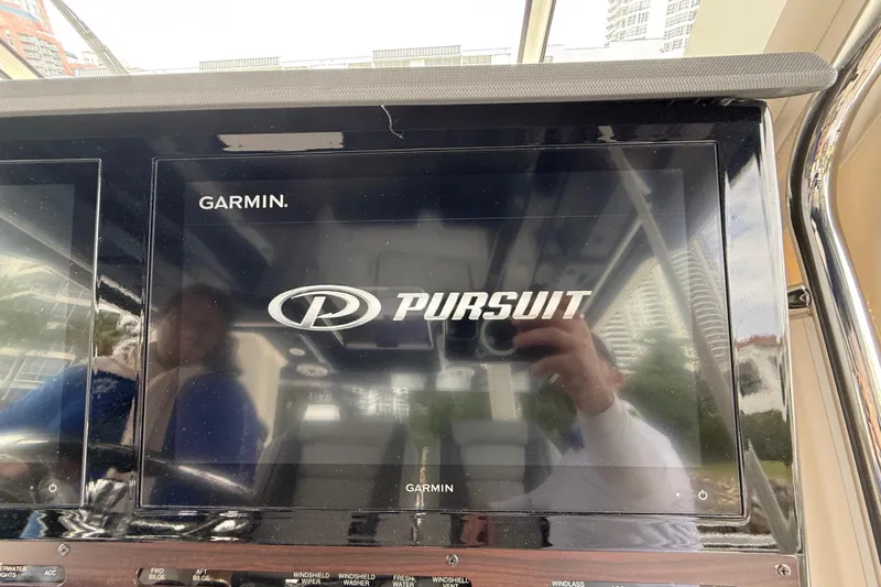 Alroma Yacht Photos Pics Garmin display on 2022 Pursuit S 358 Sport boat dashboard.
