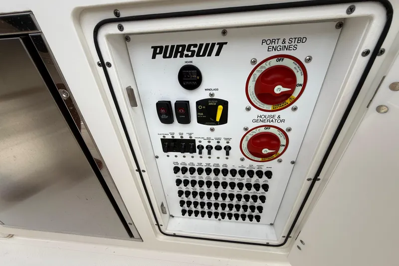 Alroma Yacht Photos Pics Control panel of 2022 Pursuit S 358 Sport boat with switches and dials.