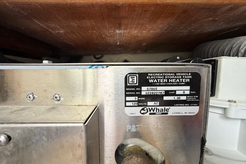 Alroma Yacht Photos Pics Water heater label on 2022 Pursuit S 358 Sport, model S700E, 6-gallon capacity.