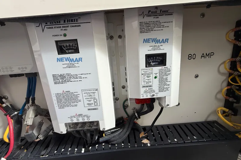 Alroma Yacht Photos Pics Electrical panel with Newmar Phase Three smart chargers, 80 AMP, in a 2022 Pursuit S 358 Sport.