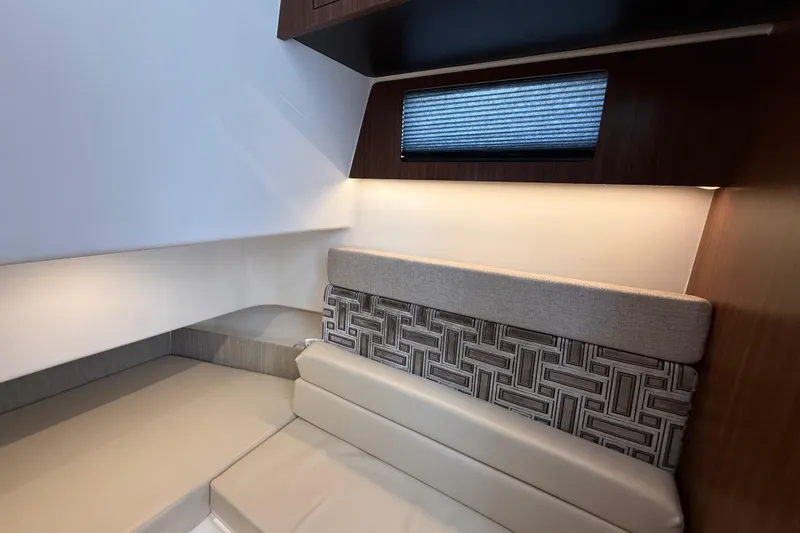 Alroma Yacht Photos Pics Interior cabin of 2022 Pursuit S 358 Sport boat, featuring modern seating and lighting.