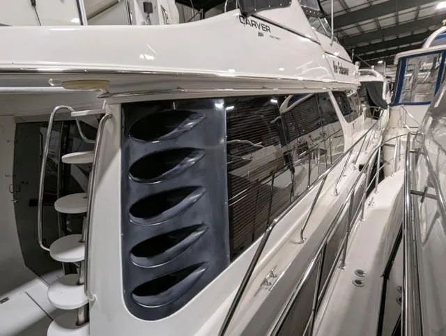 Her Endeavour II Yacht Photos Pics 1999 Carver 530 Voyager Pilothouse yacht in a marina, showcasing sleek design and modern features.