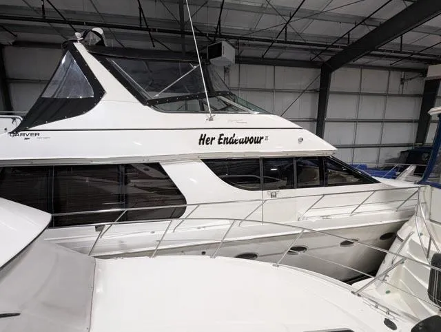 Her Endeavour II Yacht Photos Pics 1999 Carver 530 Voyager Pilothouse yacht named "Her Endeavour II" in a storage facility.