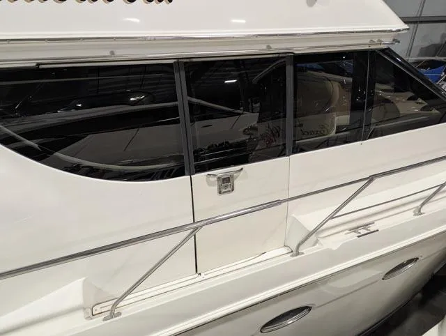 Her Endeavour II Yacht Photos Pics 1999 Carver 530 Voyager Pilothouse yacht with sleek windows and railing detail.