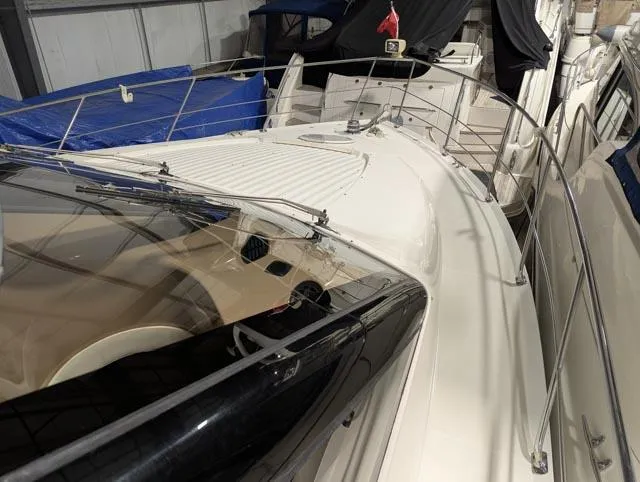 Her Endeavour II Yacht Photos Pics 1999 Carver 530 Voyager Pilothouse yacht in storage, showcasing sleek design and spacious deck.