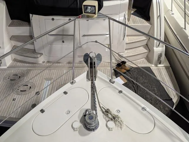 Her Endeavour II Yacht Photos Pics 1999 Carver 530 Voyager Pilothouse yacht deck with anchor and railing.