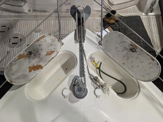 Her Endeavour II Yacht Photos Pics 1999 Carver 530 Voyager Pilothouse anchor area with storage compartments and chain.