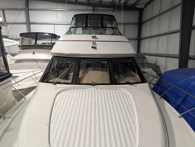 Her Endeavour II Yacht Photos Pics 1999 Carver 530 Voyager Pilothouse yacht in storage, front view.