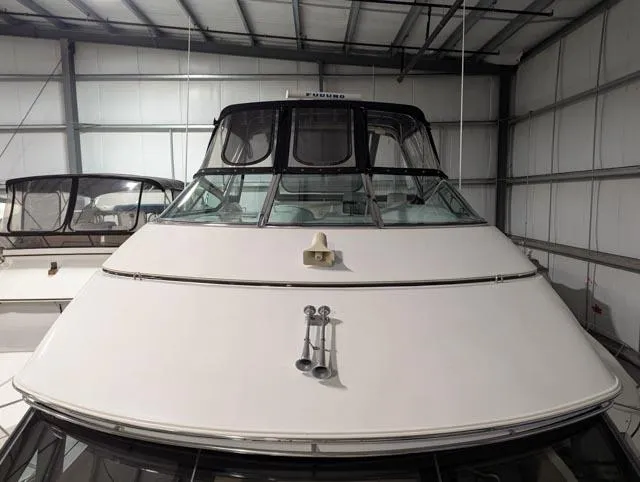 Her Endeavour II Yacht Photos Pics 1999 Carver 530 Voyager Pilothouse yacht in storage, front view.