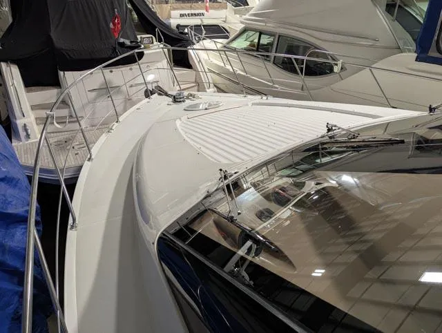 Her Endeavour II Yacht Photos Pics 1999 Carver 530 Voyager Pilothouse yacht docked in a marina, showcasing sleek design and spacious deck.